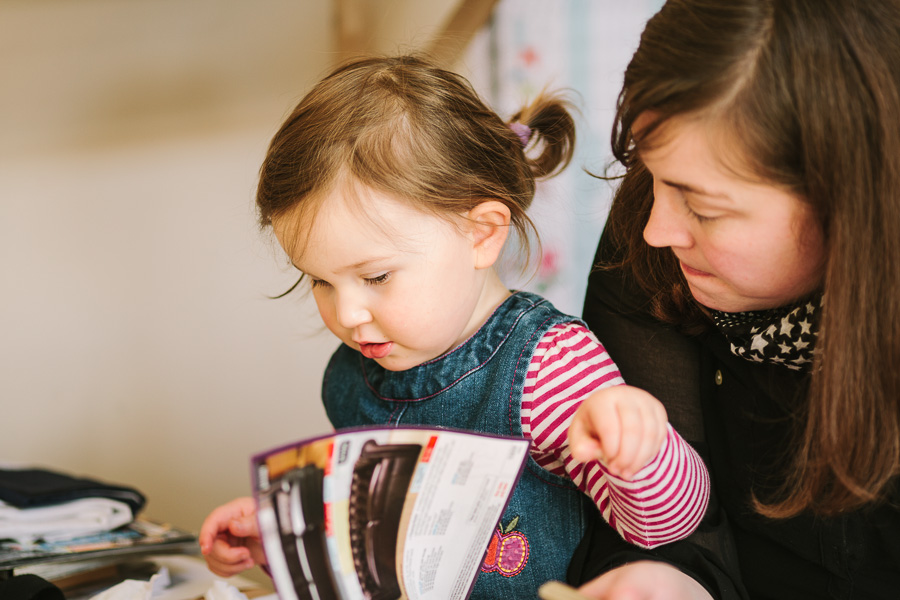 Photographer Kilkenny Ewa reading the Argos catalog