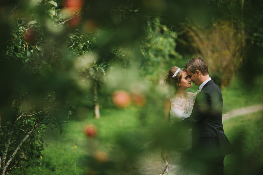 Bridal couple in the Liss Ard Estate apple orchard